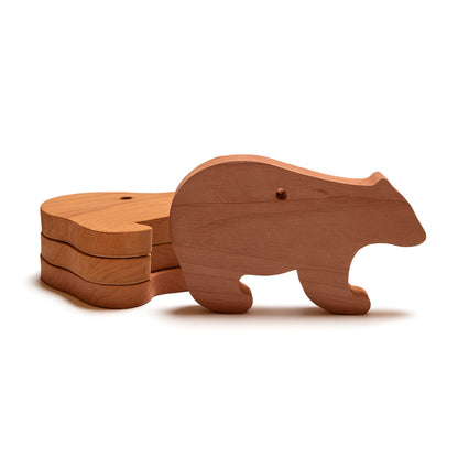 Swedish red cedarwood bear blocks shown stacked to highlight size and shape

