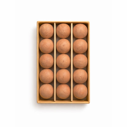 Set of 15 natural cedarwood moth balls neatly stored for wardrobe and drawer use