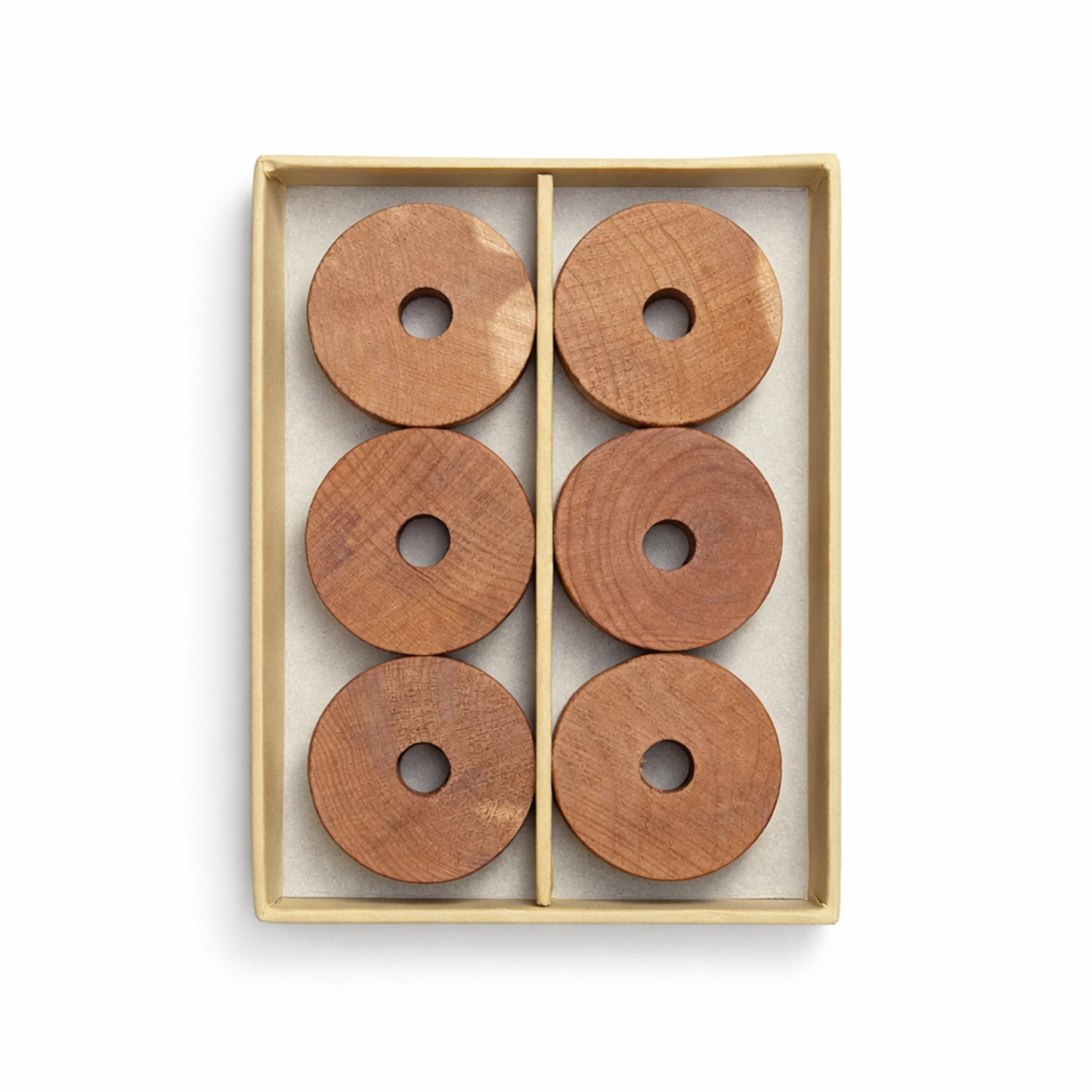 Set of six natural cedarwood rings neatly presented for wardrobe and hanger use