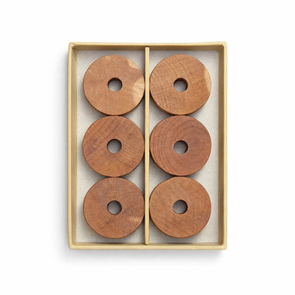 Set of six natural cedarwood rings neatly presented for wardrobe and hanger use