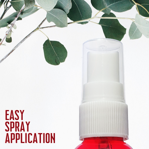 A cloes up on a red spray bottle containing red cedar oil and the text Easy Spray Application.